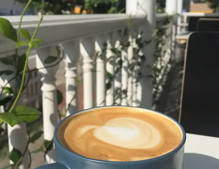 Latte on Porch of Mea Culpa Cafe